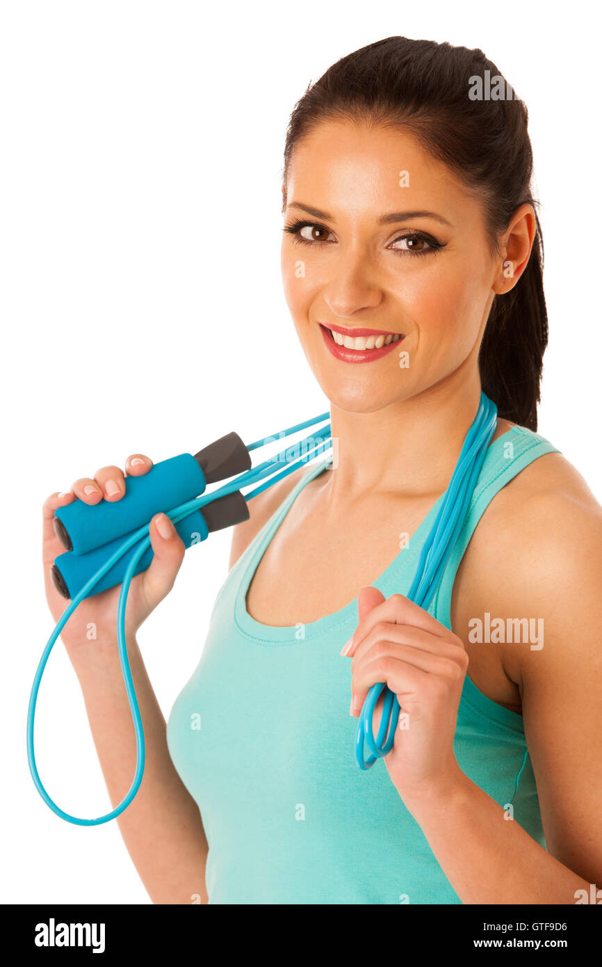 Schöne junge Frau, die mit Geschwindigkeit Seil isoliert auf weißem Hintergrund Stockfoto