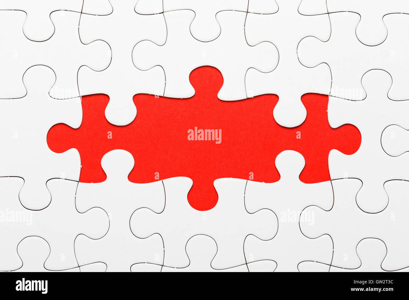 Unvollständige Puzzle in roter Farbe Stockfoto