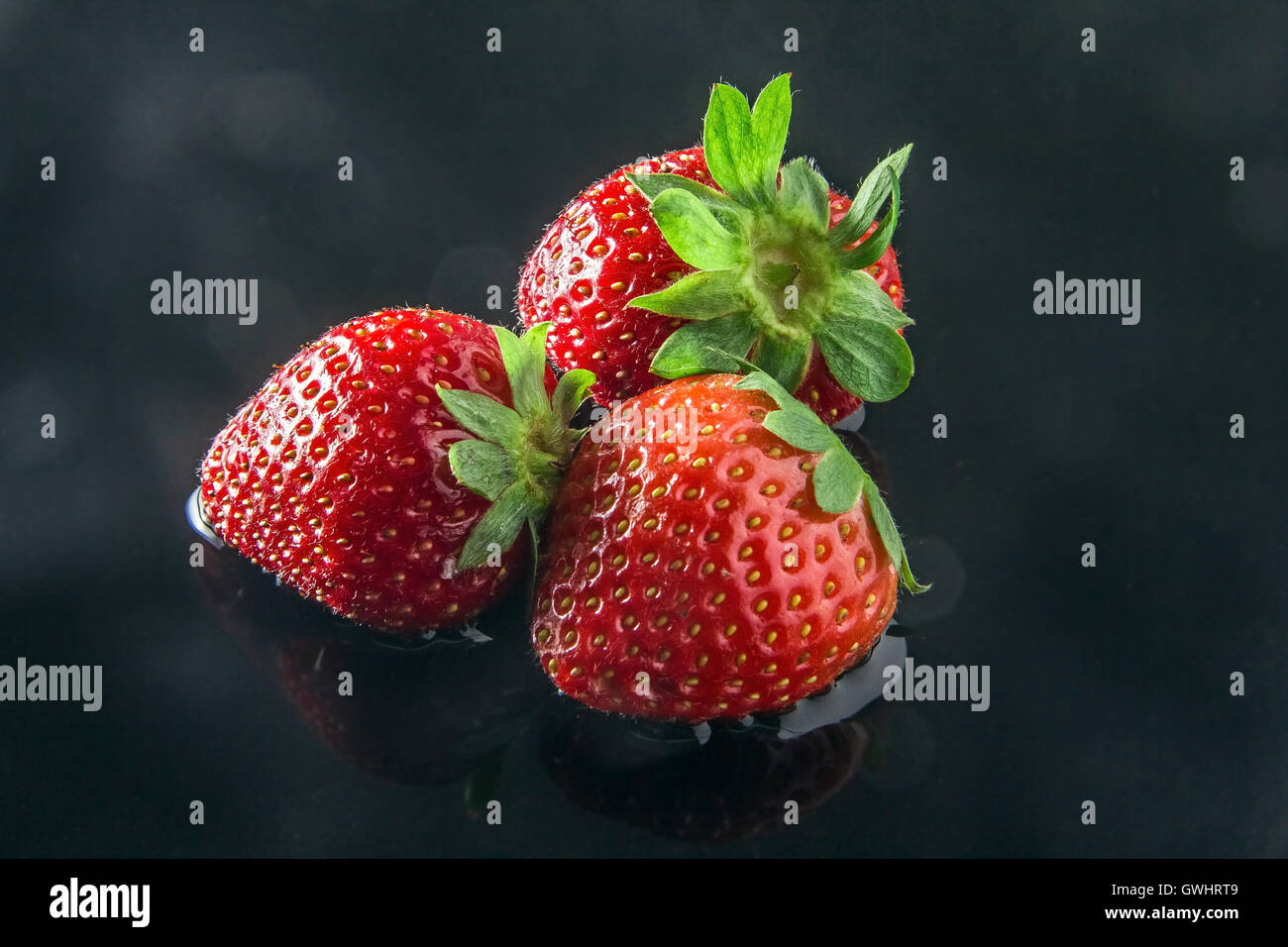 Drei Erdbeeren Stockfoto