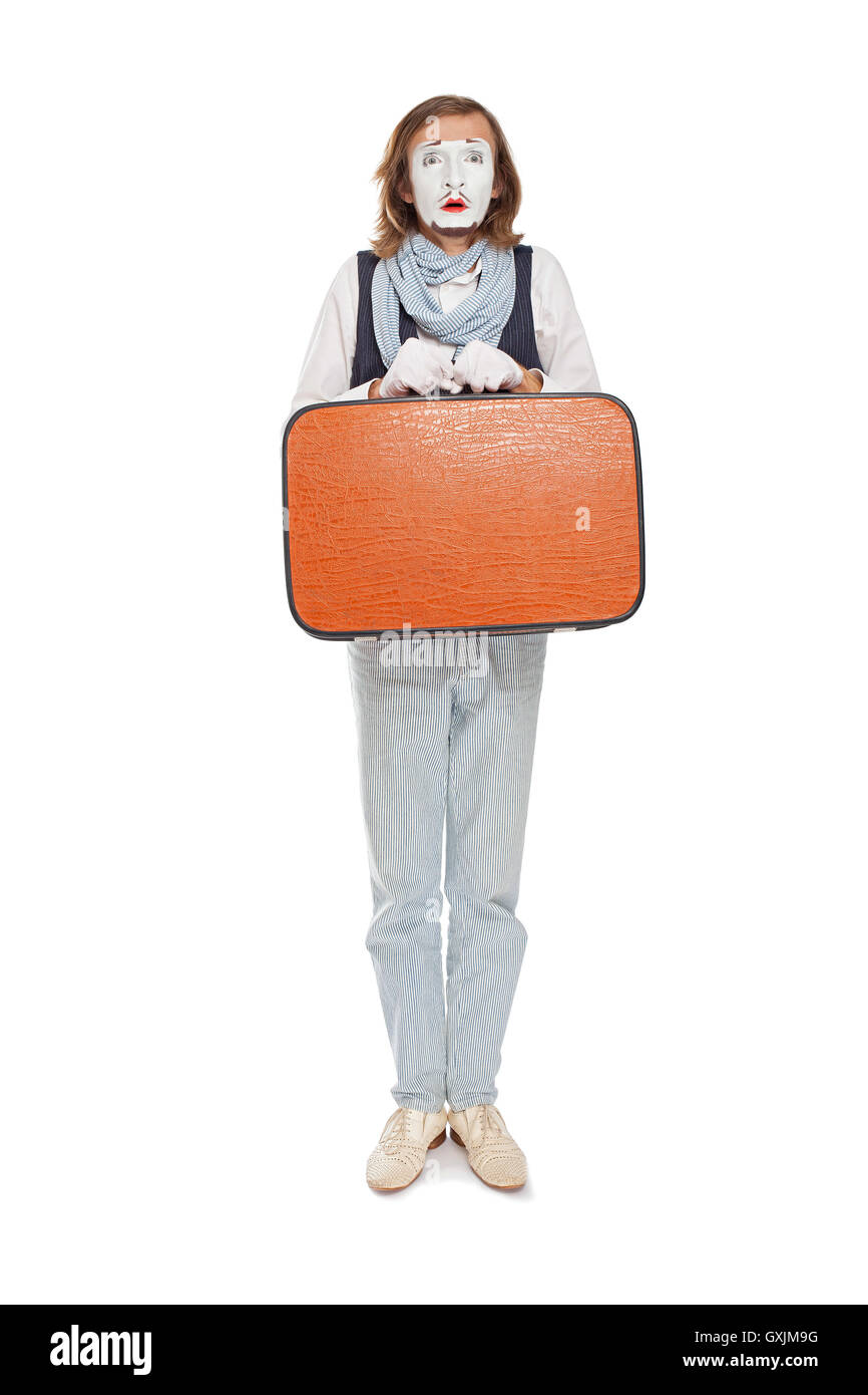 Pantomime mit orange Koffer im Vorgriff auf Stockfoto