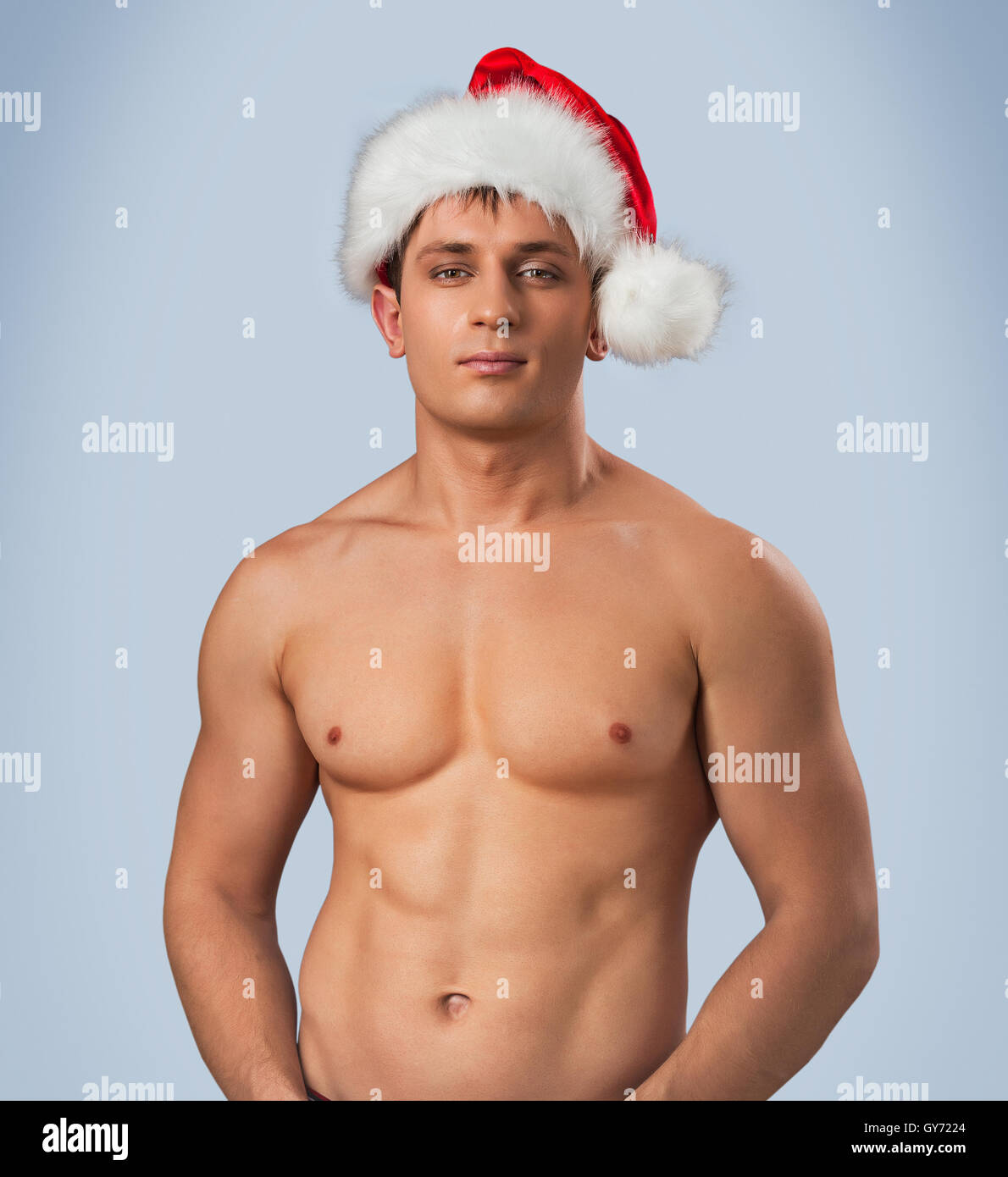 Porträt von nackten männlichen in Santa cap Stockfoto