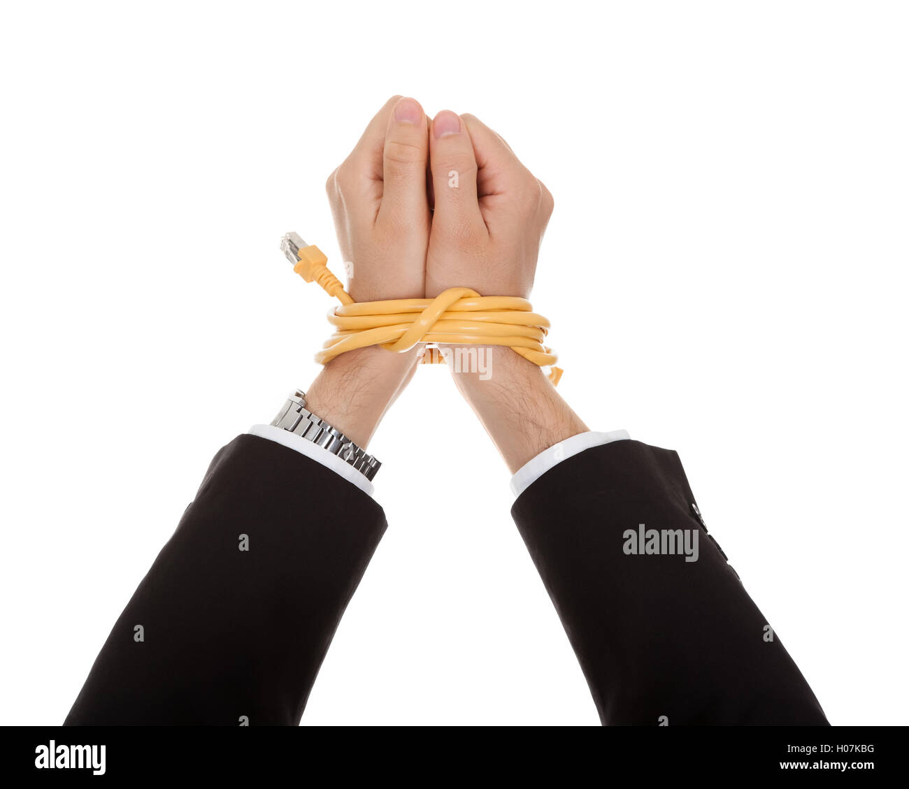 Geschäftsmann mit Händen gefesselt in Netzwerkkabel Stockfoto