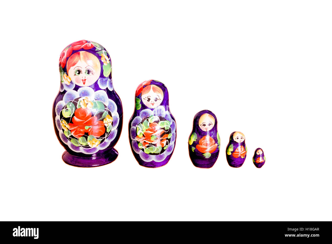 Reihe von bunten russischen Matrjoschka-Puppen set vor einem weißen Hintergrund Stockfoto