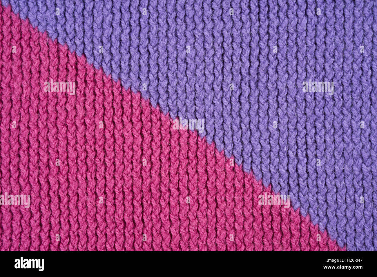 Pink und violett, die Stricken als nahtlose Hintergrund Stockfoto