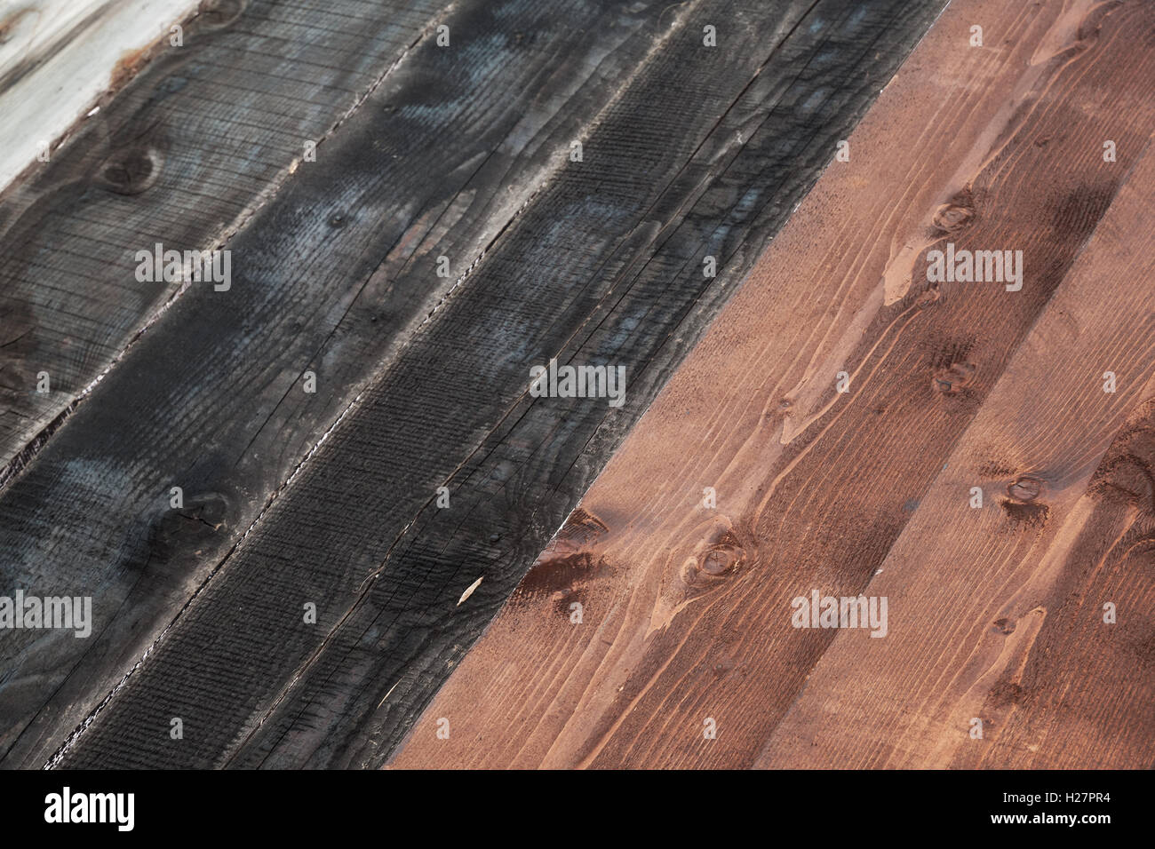 Schwarze und braune Planken. Holzboden Hintergrundtextur Foto Stockfoto
