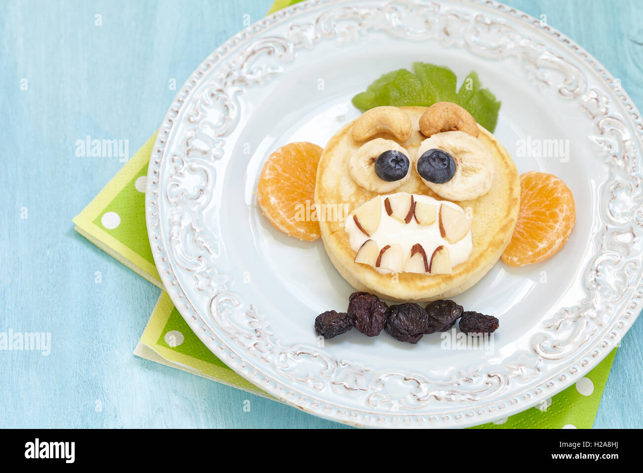 Grinsender Affe lustige Halloween-Pfannkuchen Stockfoto