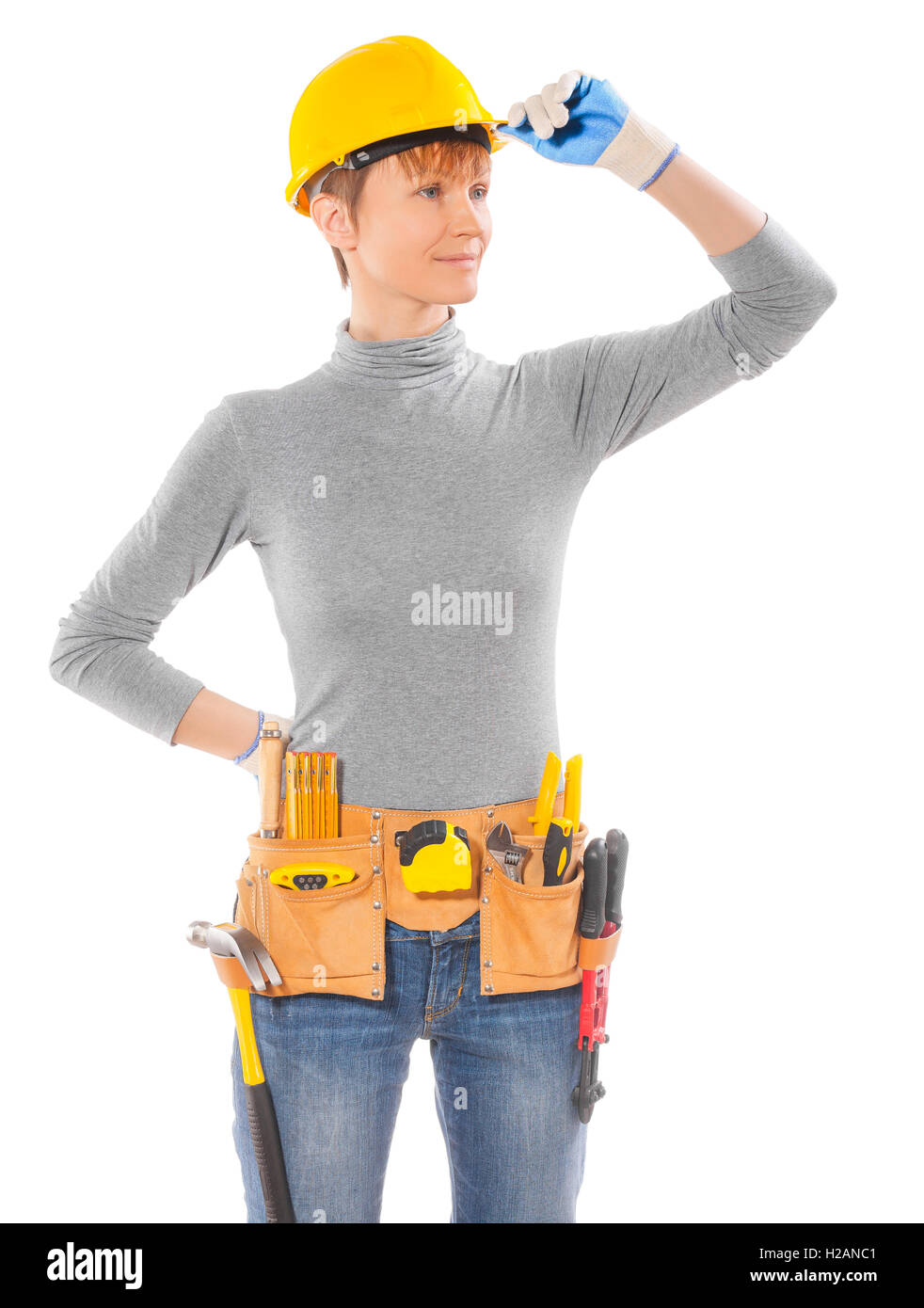 Weibchen tragen Arbeitskleidung mit Gürtel von Werkzeugen isoliert Stockfoto