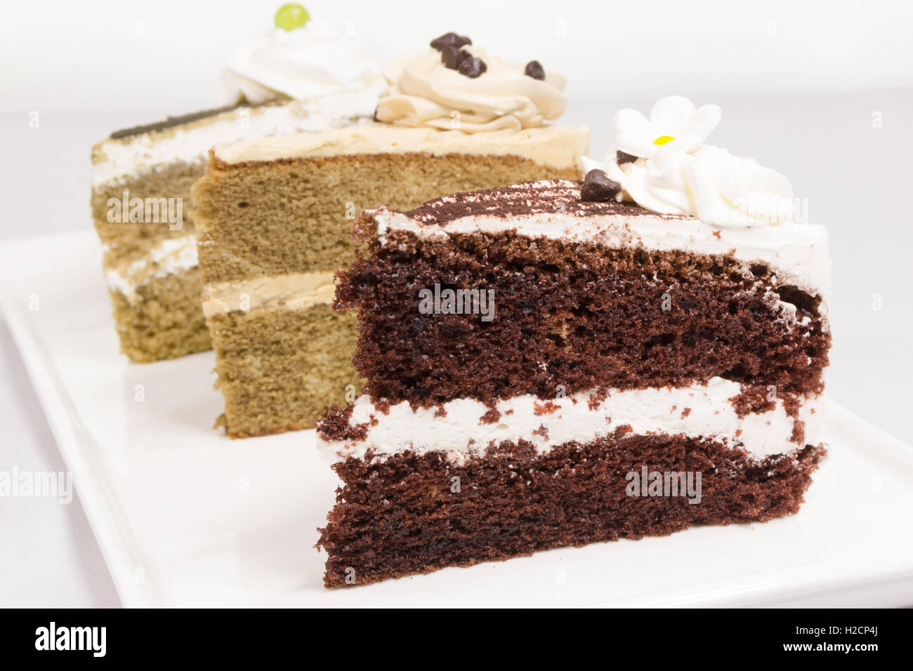 drei Stück Kuchen Stück auf Platte Stockfoto