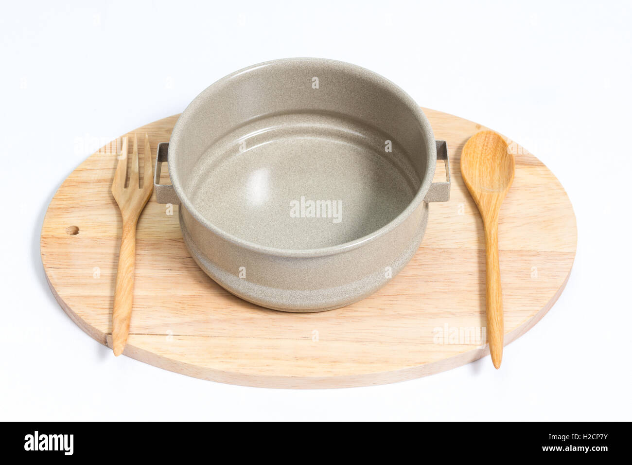 leere Tiffin mit hölzernen Löffel Gabel auf Holz isoliert auf mit Hintergrund Stockfoto