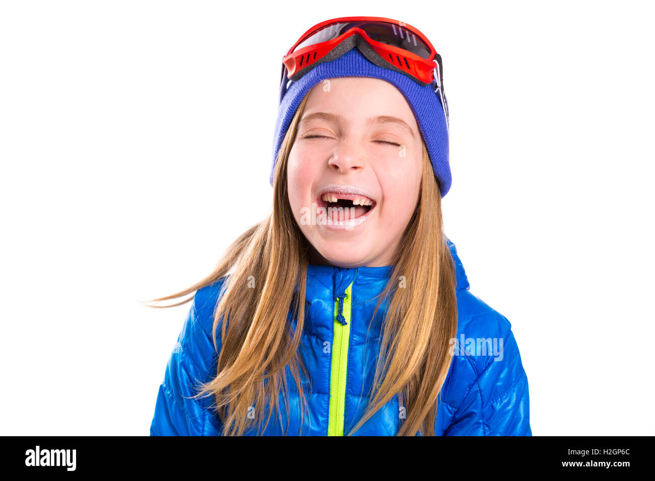 Verrücktes Lachen lustig Kind Mädchen mit Wintermütze Stockfoto