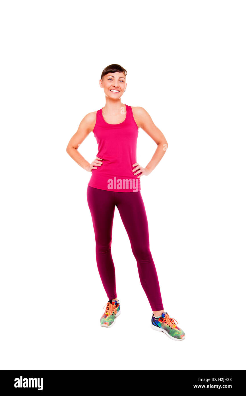 Junge Frau im Fitness-Outfit Isoleted auf weißem Hintergrund in die Kamera Lächeln. Stockfoto