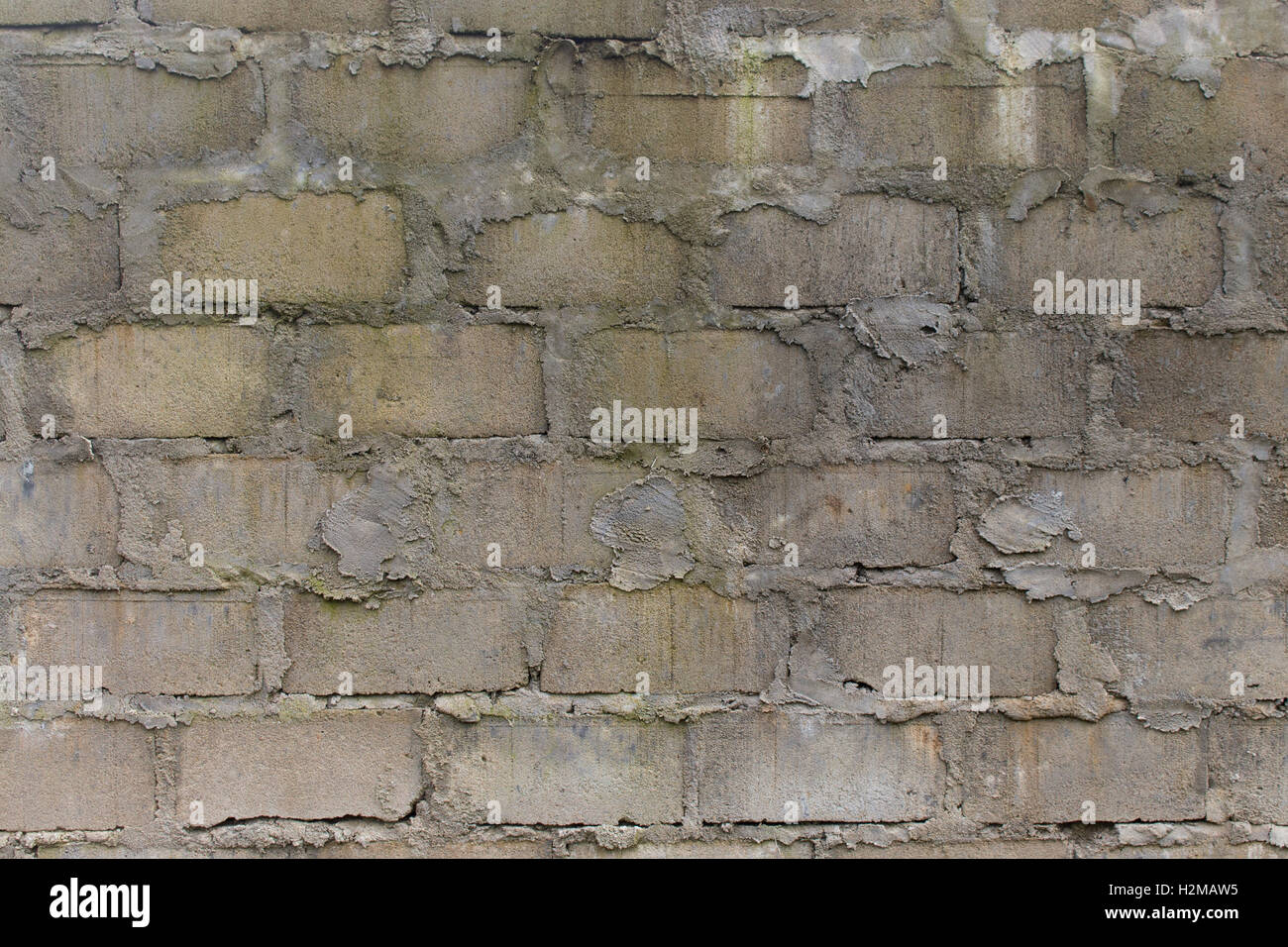 Eine grobe und stark strukturierte Betonklotz Betonmauer geeignet für Hintergründe. Stockfoto