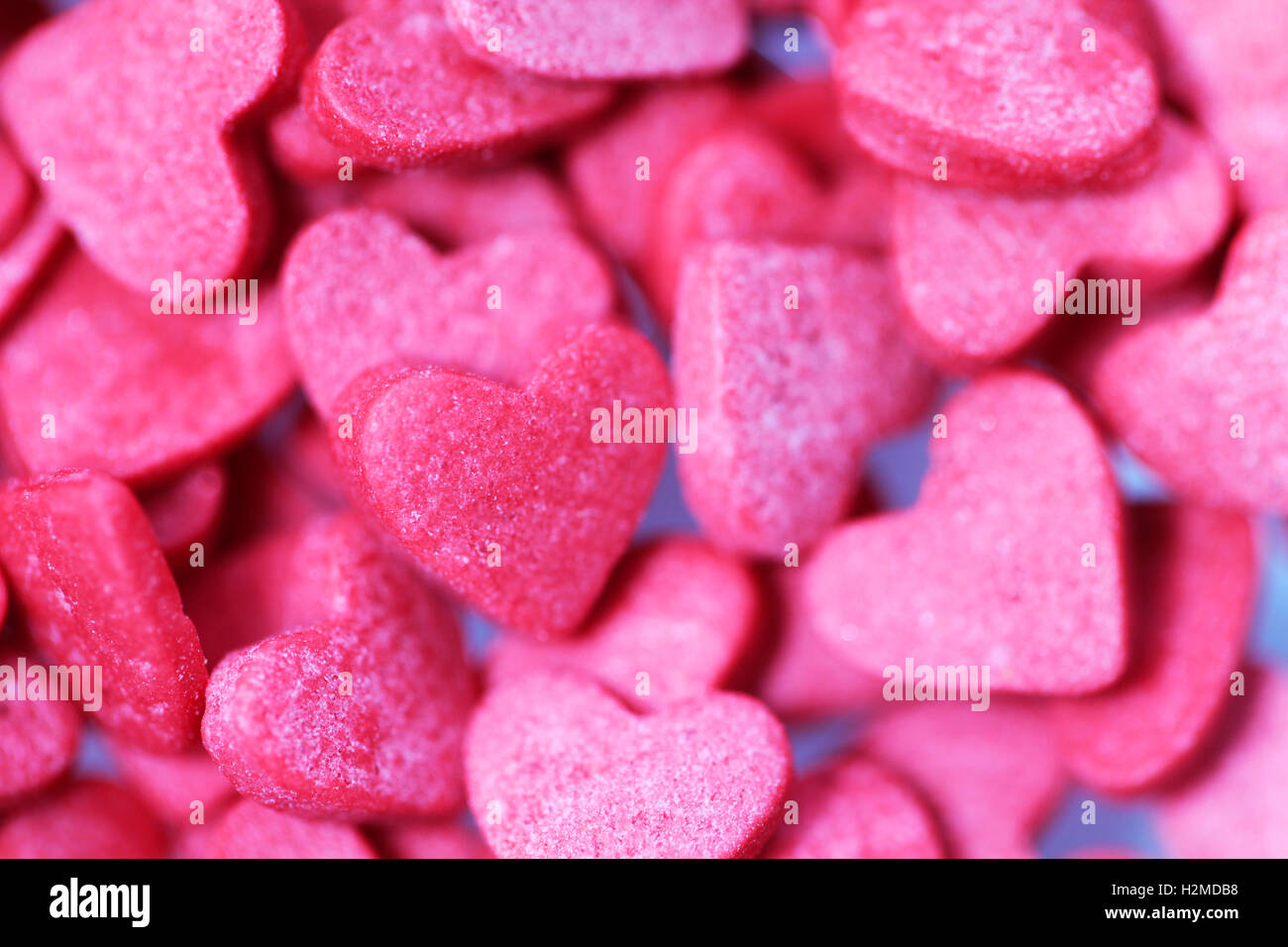 Herz rosa Süßigkeiten Hintergrund für den Valentinstag Stockfoto