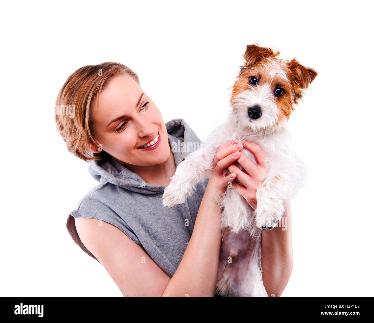 Glückliche Frau mit Hund - auf einem weißen Hintergrund isoliert Stockfoto