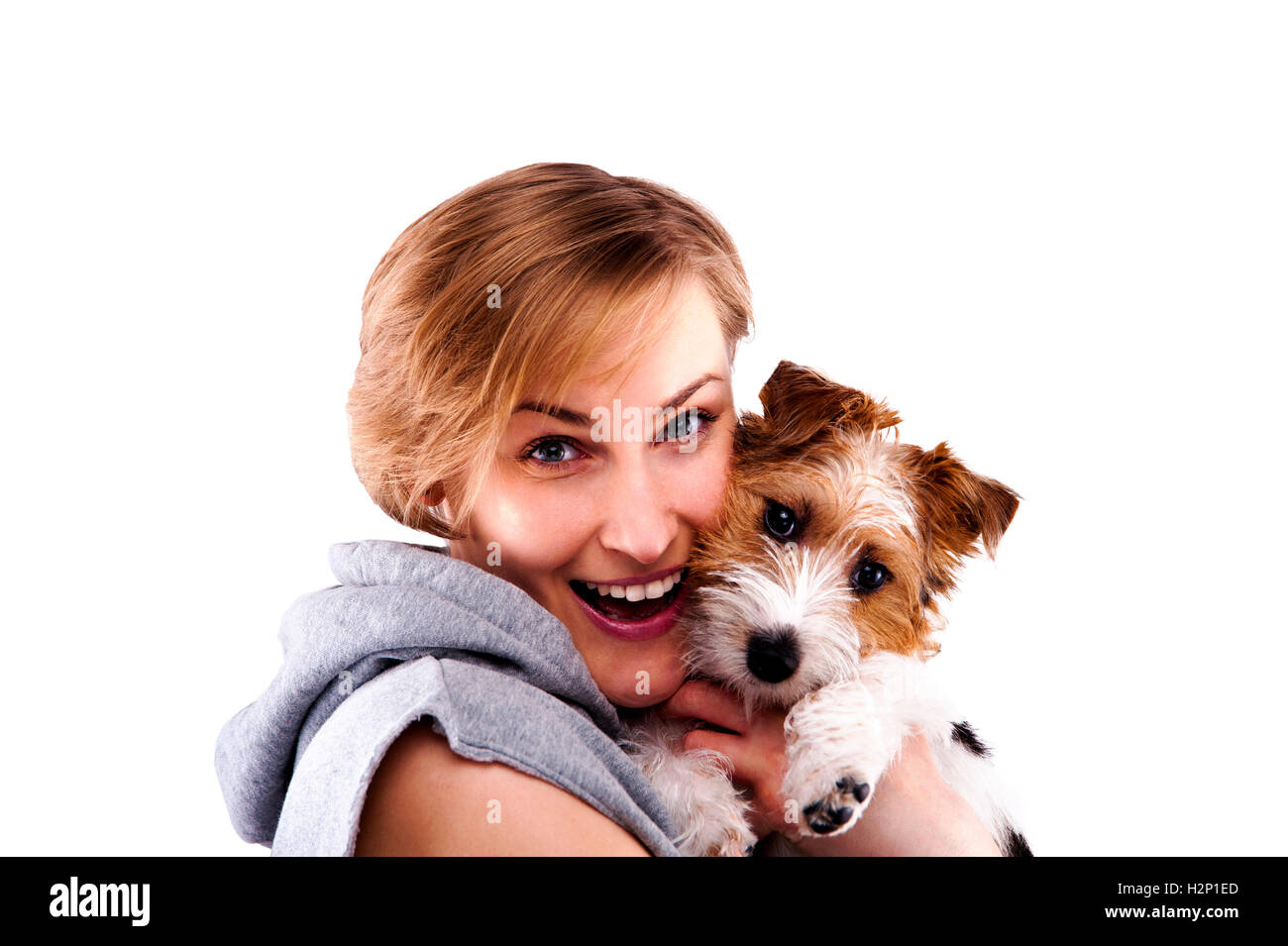 Glückliche Frau mit Hund - auf einem weißen Hintergrund isoliert Stockfoto