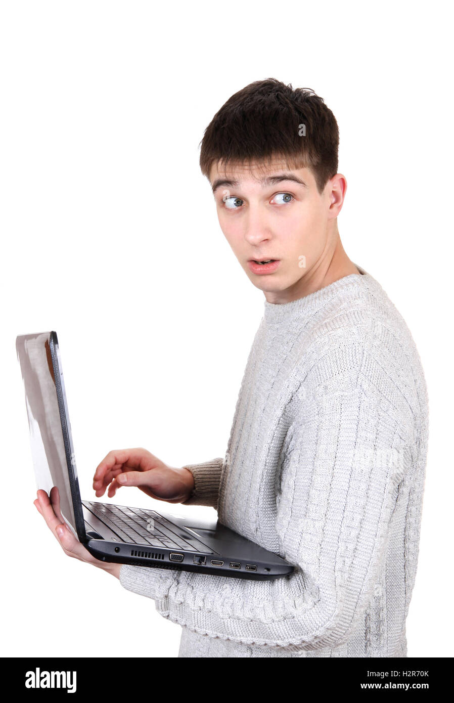 Erschrocken Teenager mit Laptop Stockfoto