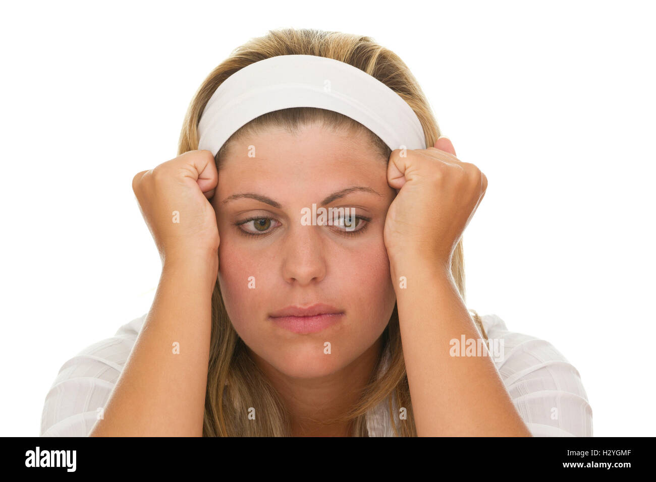 Junge Frau hält ihren Kopf in ihre Hände, depression Stockfoto