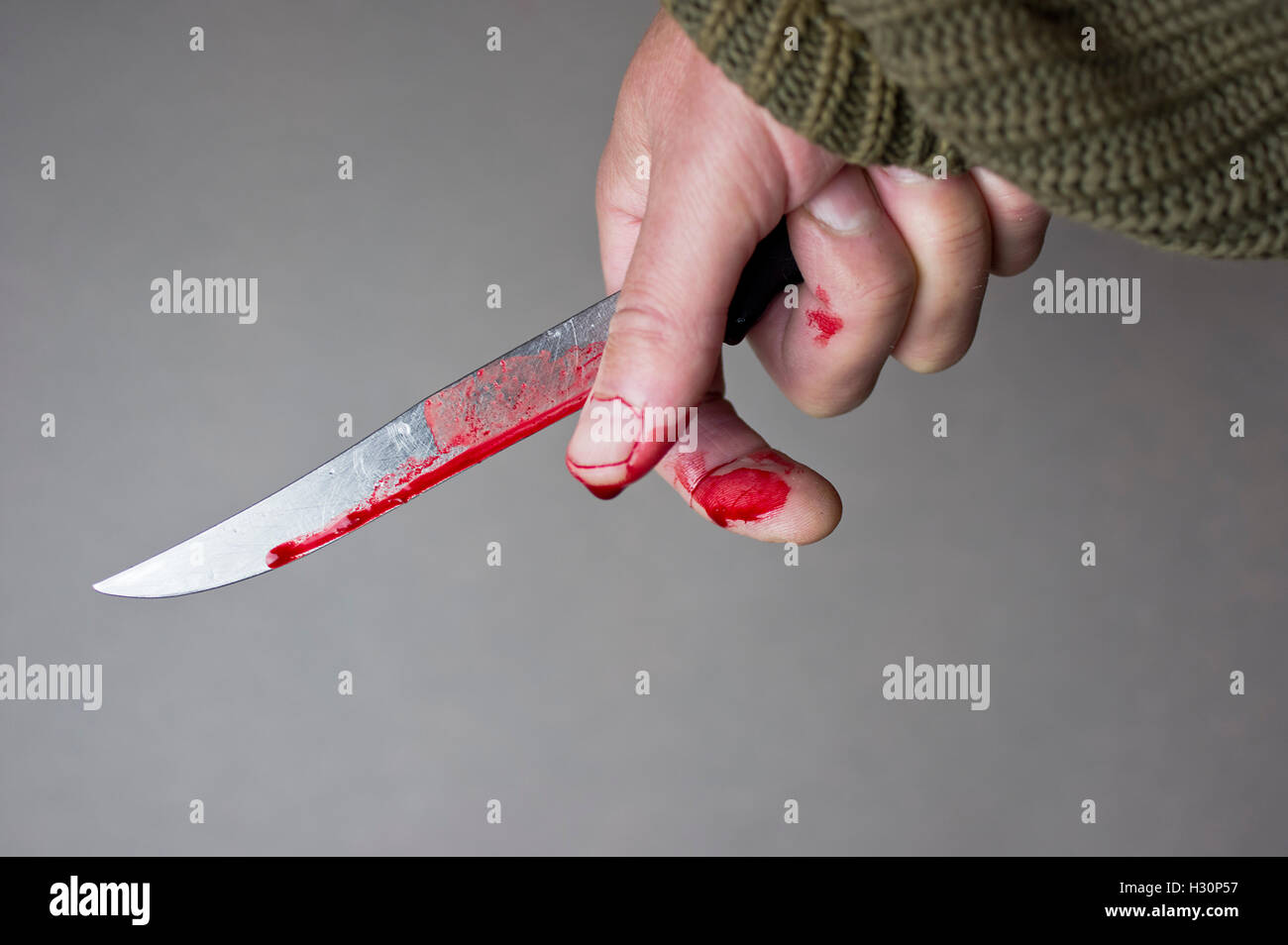 Hand mit Blutungen Messer Stockfoto