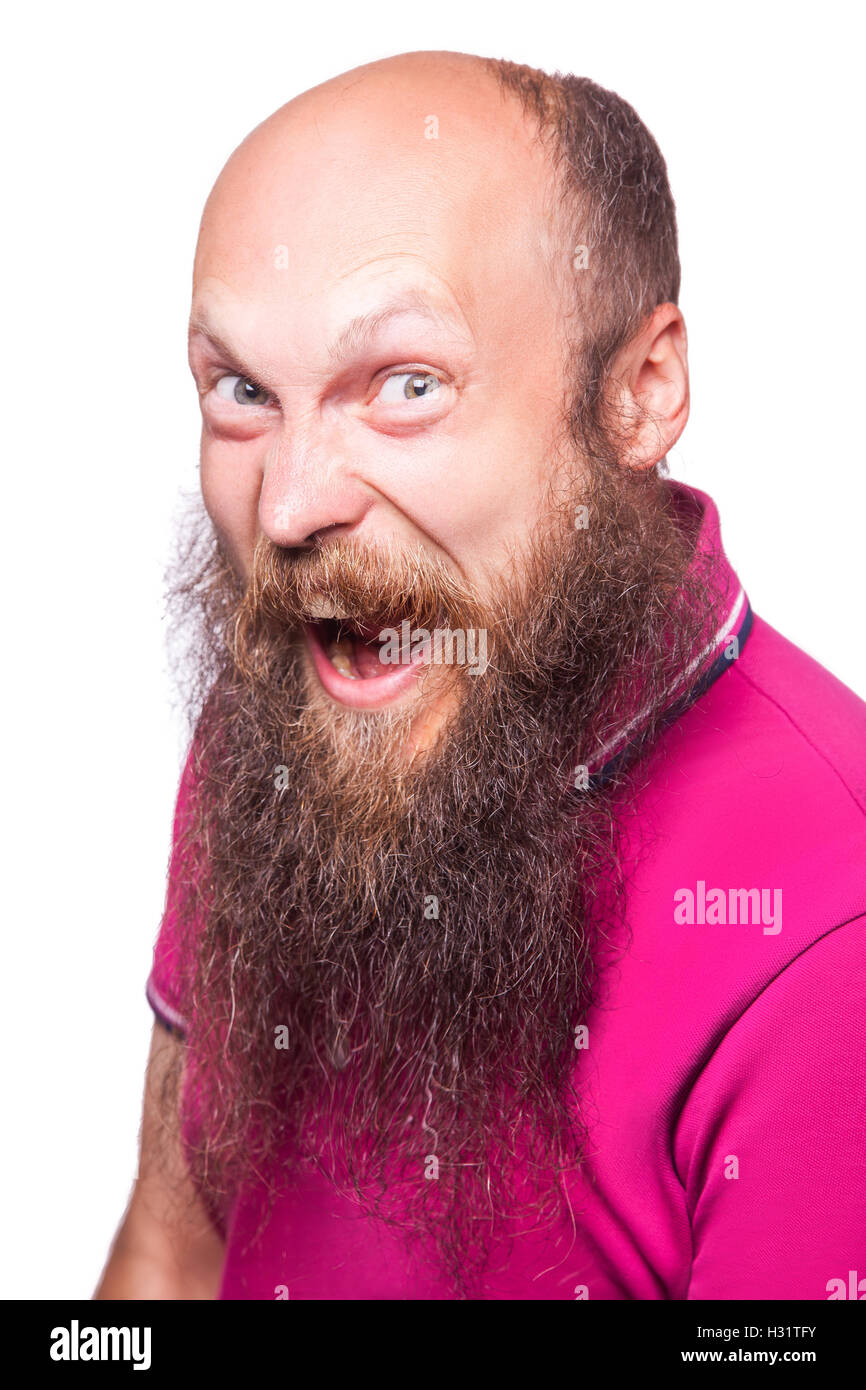 Entfesselt Emotionen. Frustrierte junge Mann mit blauen geöffneten Augen und Mund öffnete stehend Blick in die Kamera, isoliert auf wh Stockfoto