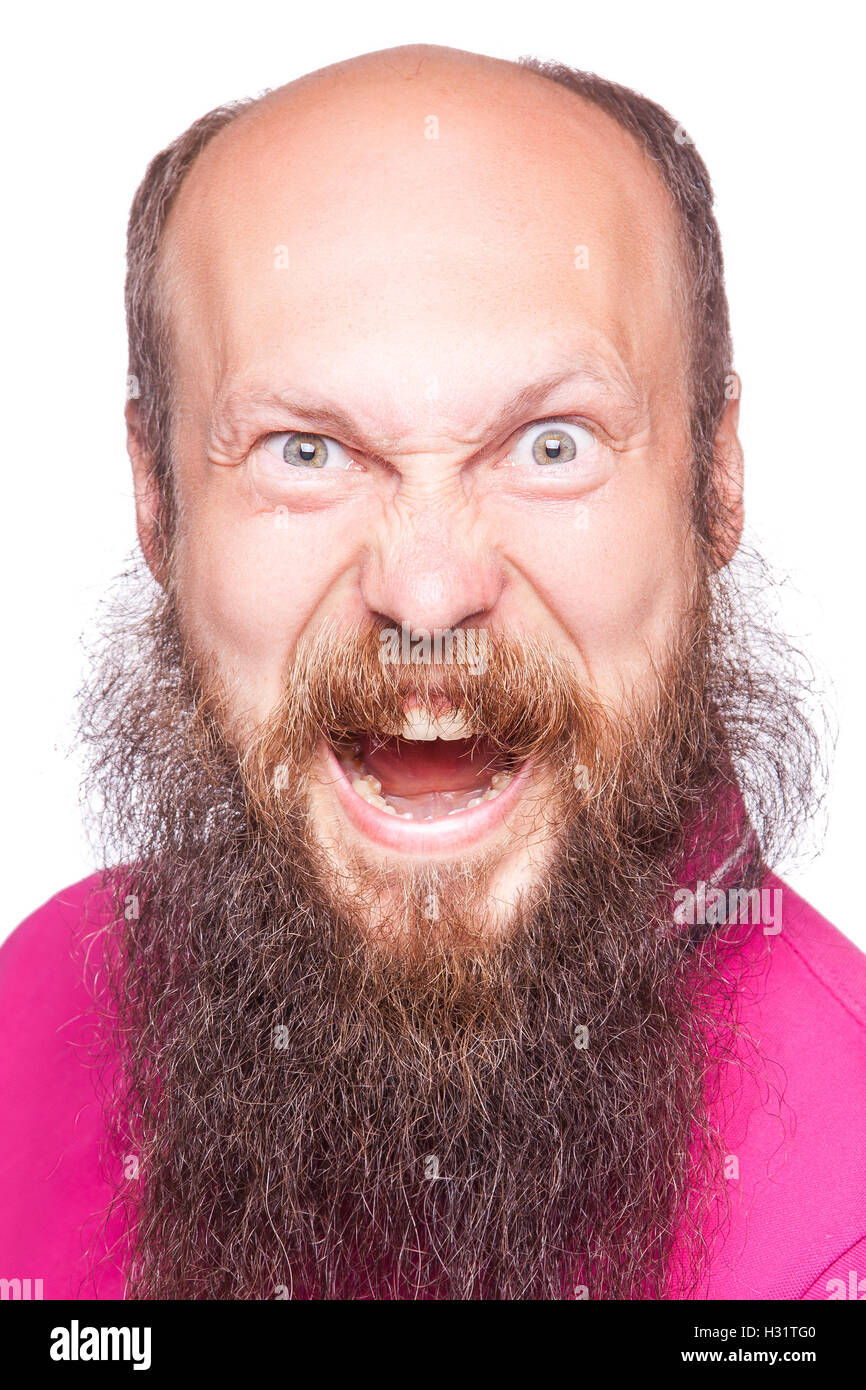 Entfesselt Emotionen. Frustrierte junge Mann mit blauen geöffneten Augen und Mund öffnete stehend Blick in die Kamera, isoliert auf wh Stockfoto