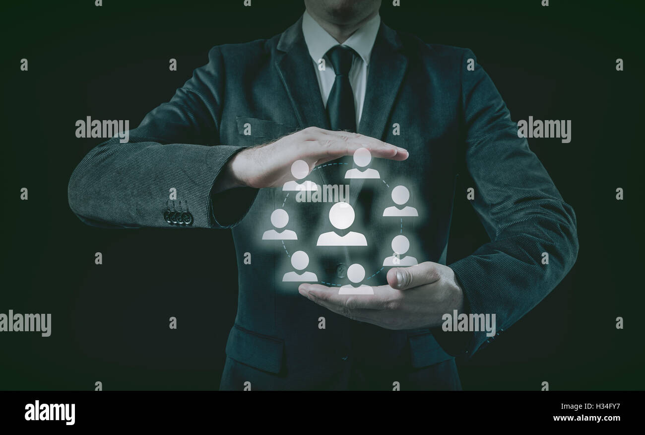 Hand mit Geschäftsmann Symbol Netzwerk - HR, HRM, MLM, Teamwork und Leadership-Konzept Stockfoto