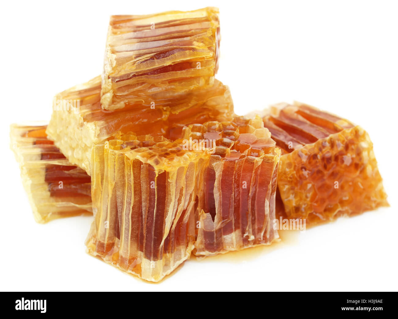Honig-Kamm auf weißem Hintergrund Stockfoto