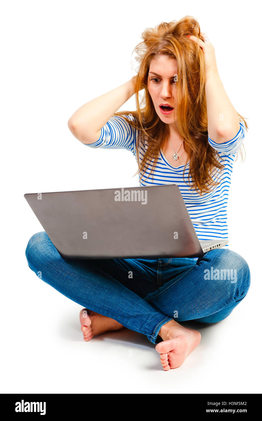 Mädchen mit Laptop drückt Emotionen Stockfoto