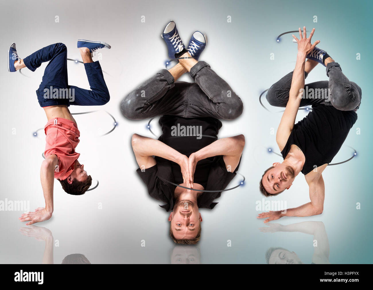 Breakdancer tun Handstand vor weißem Hintergrund Stockfoto