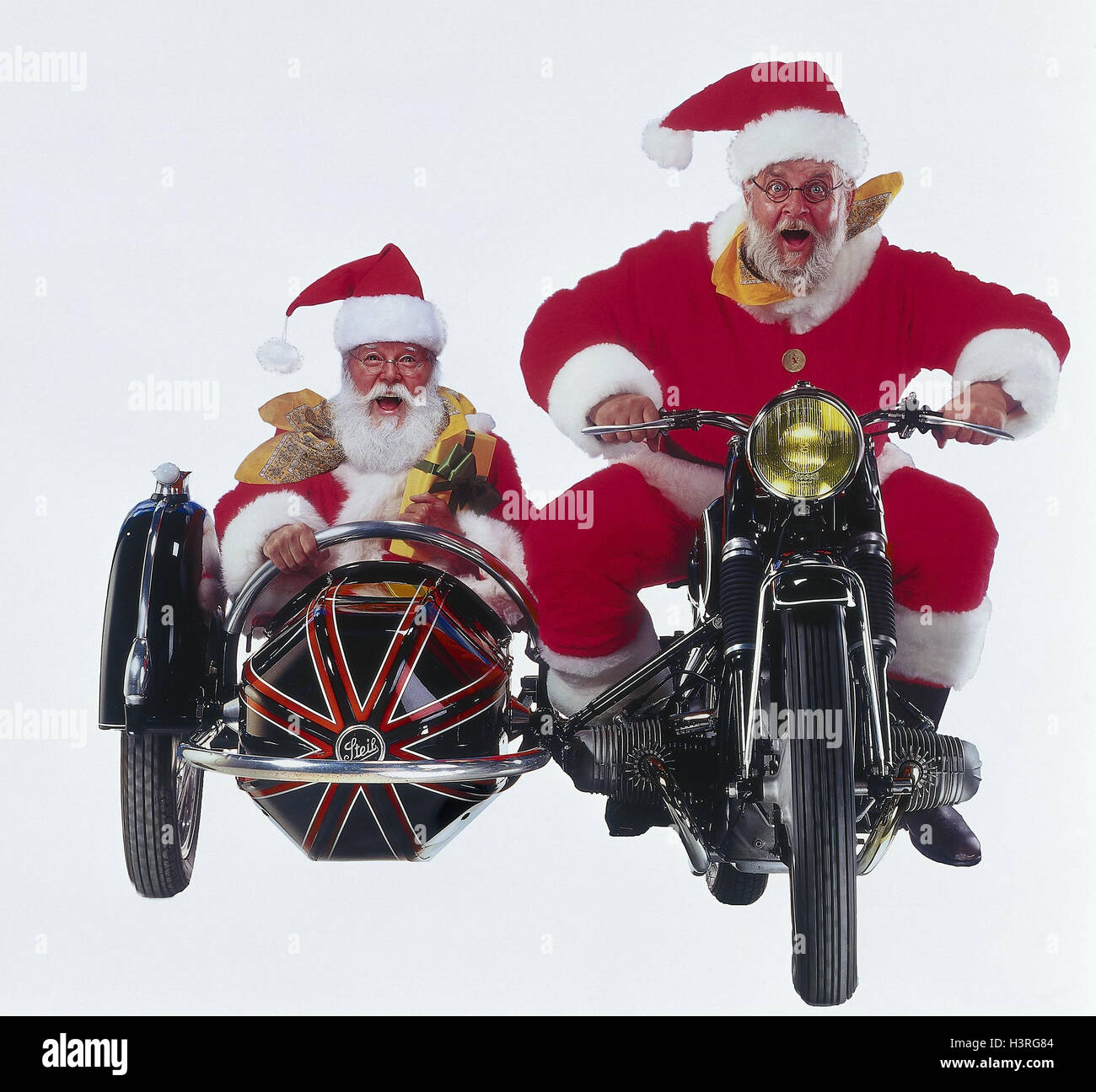 Weihnachtsmänner, Motorrad, Beiwagen, Mimik, Spaß, Freude Studio,  ausgeschnitten, Weihnachten, Weihnachten, Weihnachtsmann, Santa, zwei,  Motorrad fahren, Oldtimer, glücklich Stockfotografie - Alamy