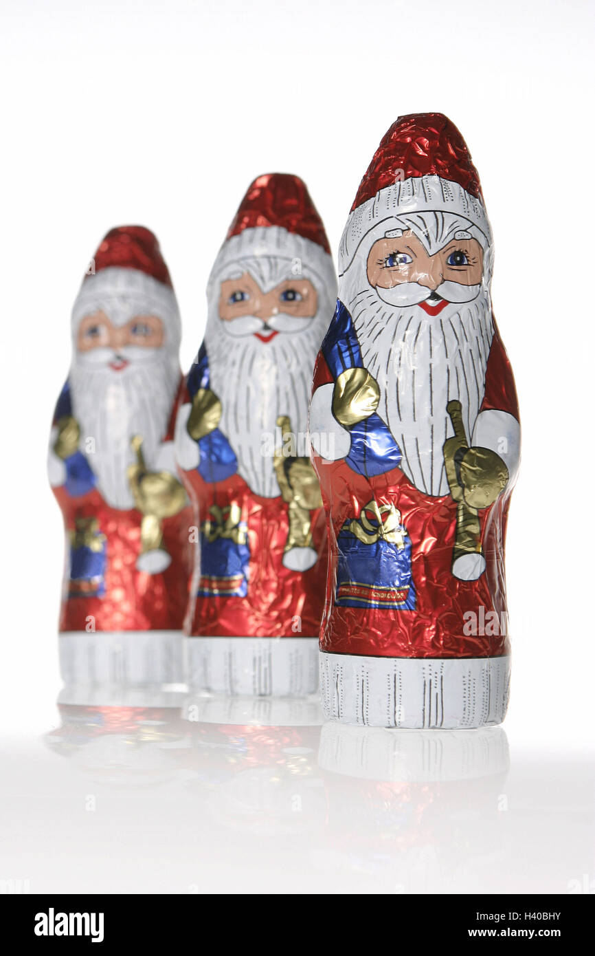 Schokolade Nicholases, drei Schokolade Nicholases, Schokoladen Weihnachtsmann, Schokoladen Weihnachtsmann, Schokolade, Süßigkeiten, süß, süß, enthält Zucker, Icon, Naschen, Advent, Santa, Weihnachtsmänner, Weihnachten, Yule Flut, Weihnachtszeit, Kindheit, Produkt-Fotografie Stockfoto