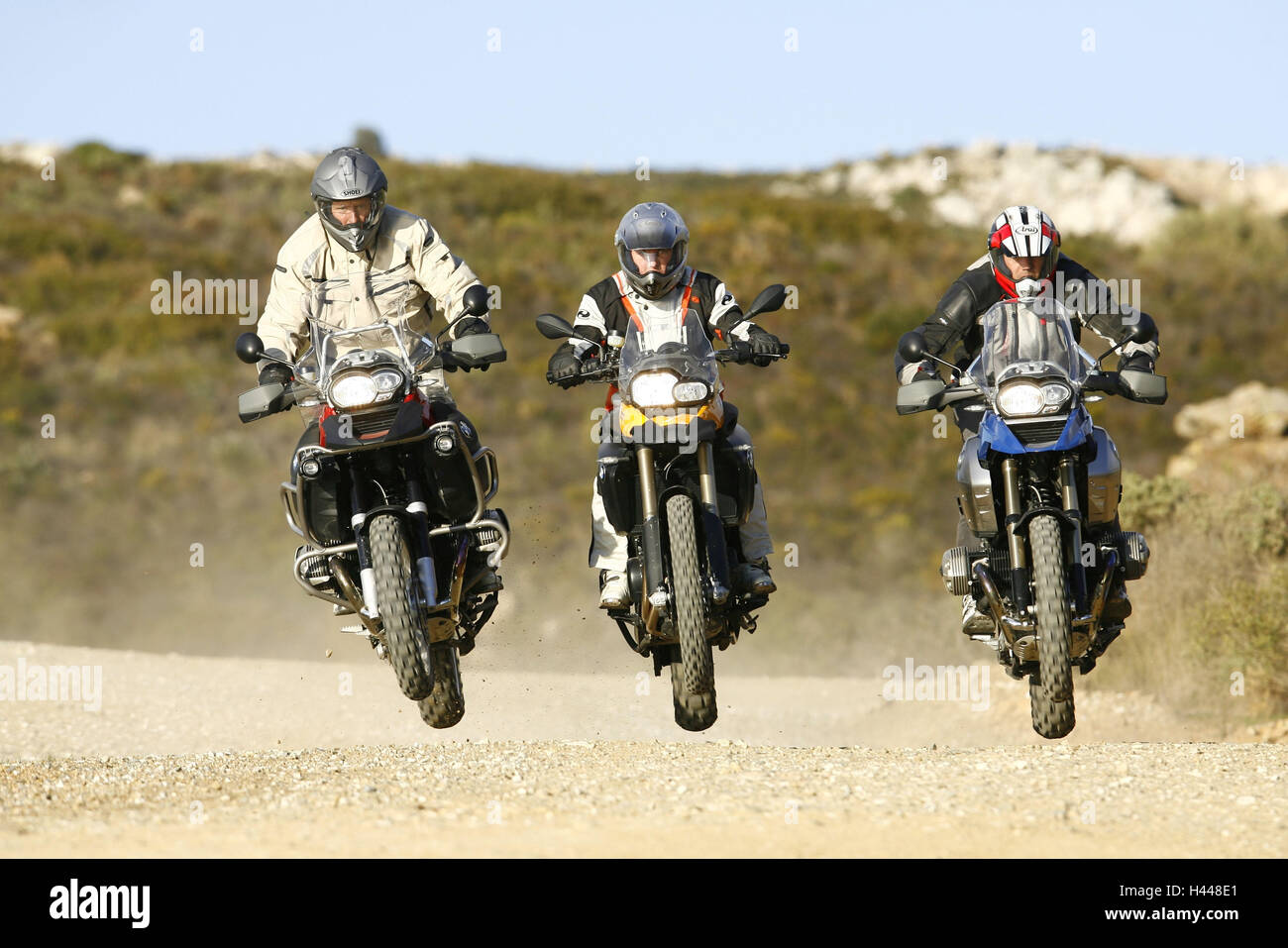 drei Motorradfahrer, BMW GS, knacken, Stockfoto