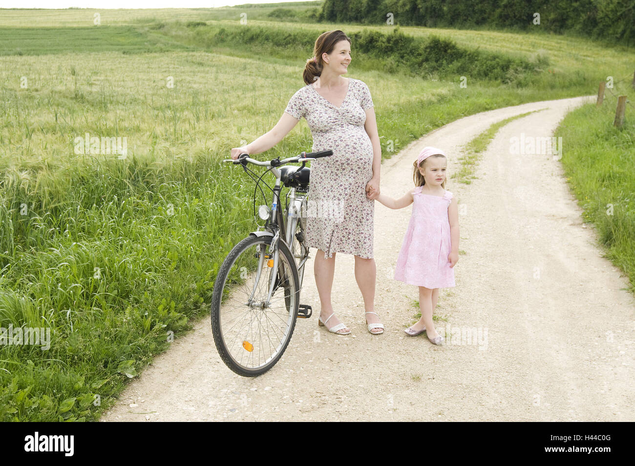 Reiten Sie Frau, ein Motorrad schwanger, Tochterunternehmen, glücklich, Stockfoto