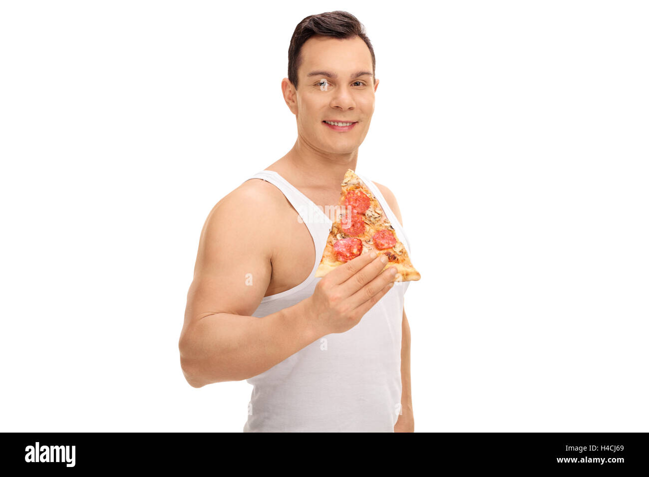 Junger Mann mit einem Pizzastück isoliert auf weißem Hintergrund Stockfoto