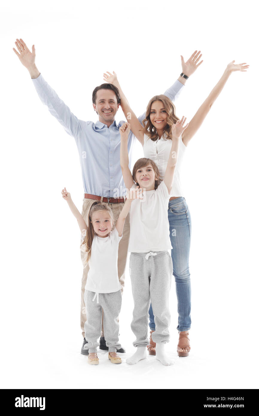 Glückliche Familie mit erhobenen Händen, isoliert auf weißem Hintergrund Stockfoto