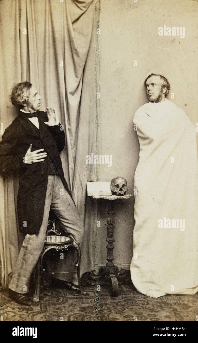 Zwei stehende Männer handeln Nebenanlage Sing Gespenst mit Schädel auf dem Tisch zwischen ihnen, L. de Koningh, 1860-1880 Stockfoto
