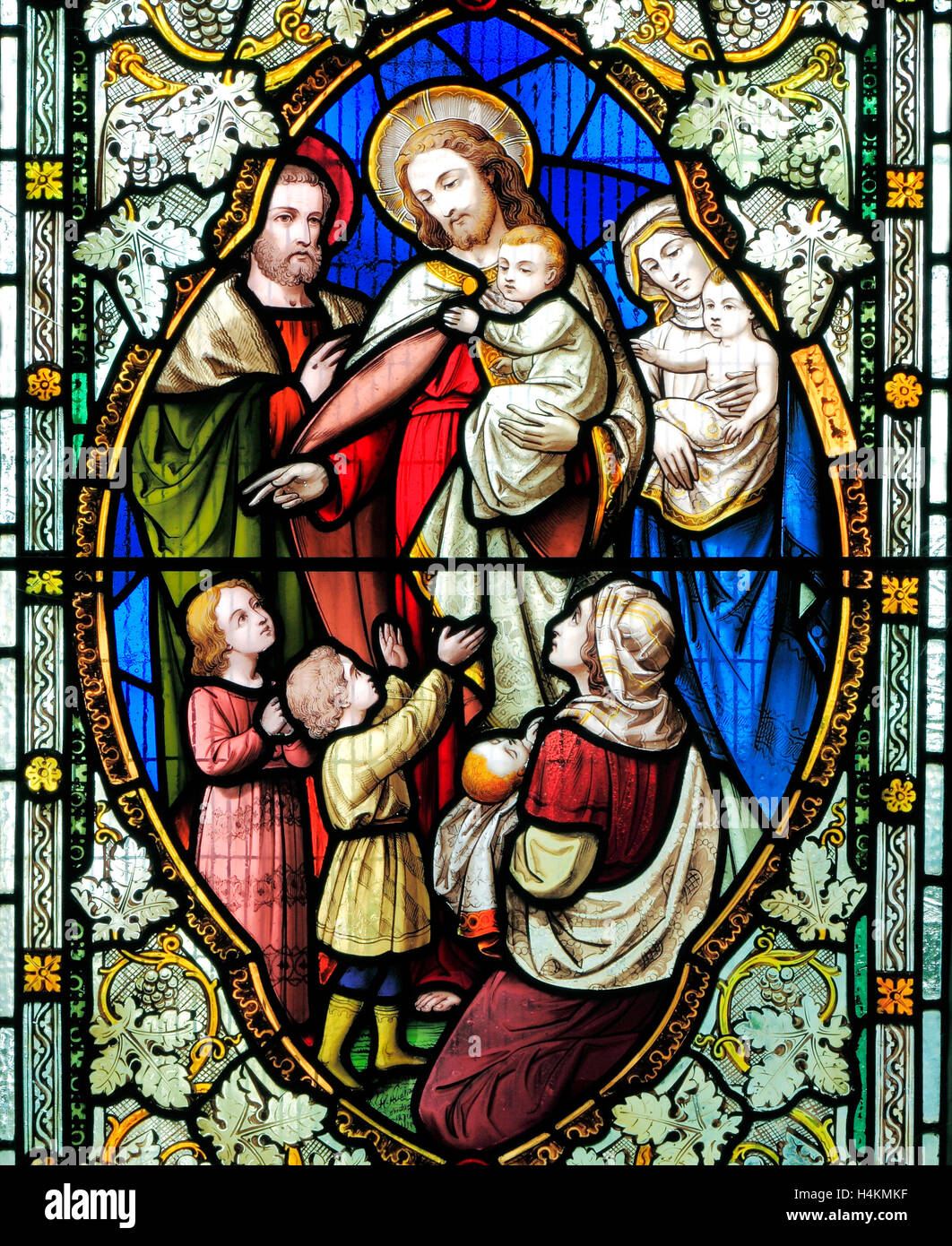 Leiden die Kleinkinder, Segnung durch Jesus, Glasfenster von Ward & Hughes, 1869, Stanhoe, Norfolk Stockfoto