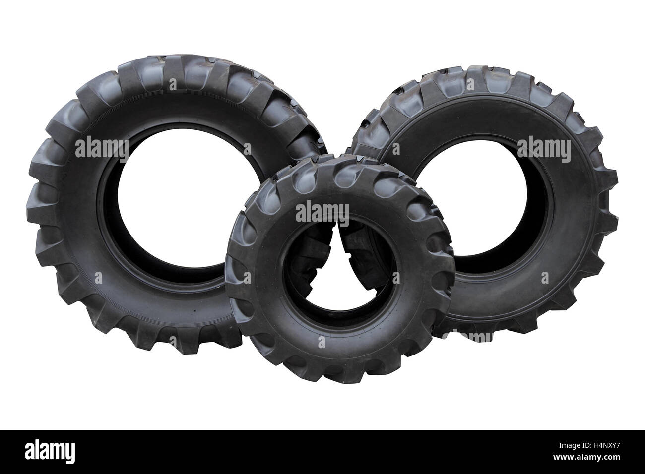 Drei Traktorreifen isoliert auf weißem Hintergrund Stockfoto