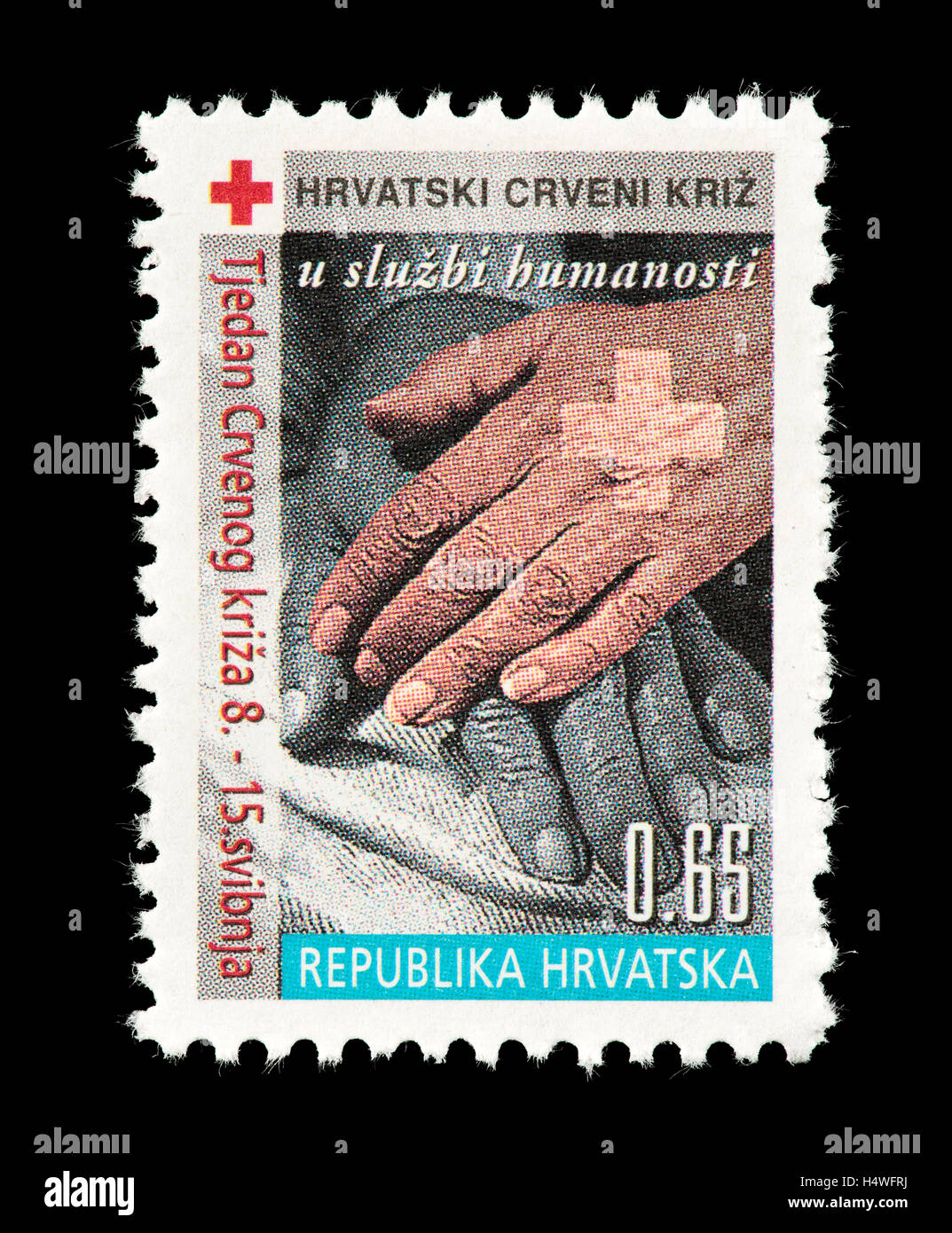 Briefmarke aus Kroatien mit Händen, für das rote Kreuz Stockfoto