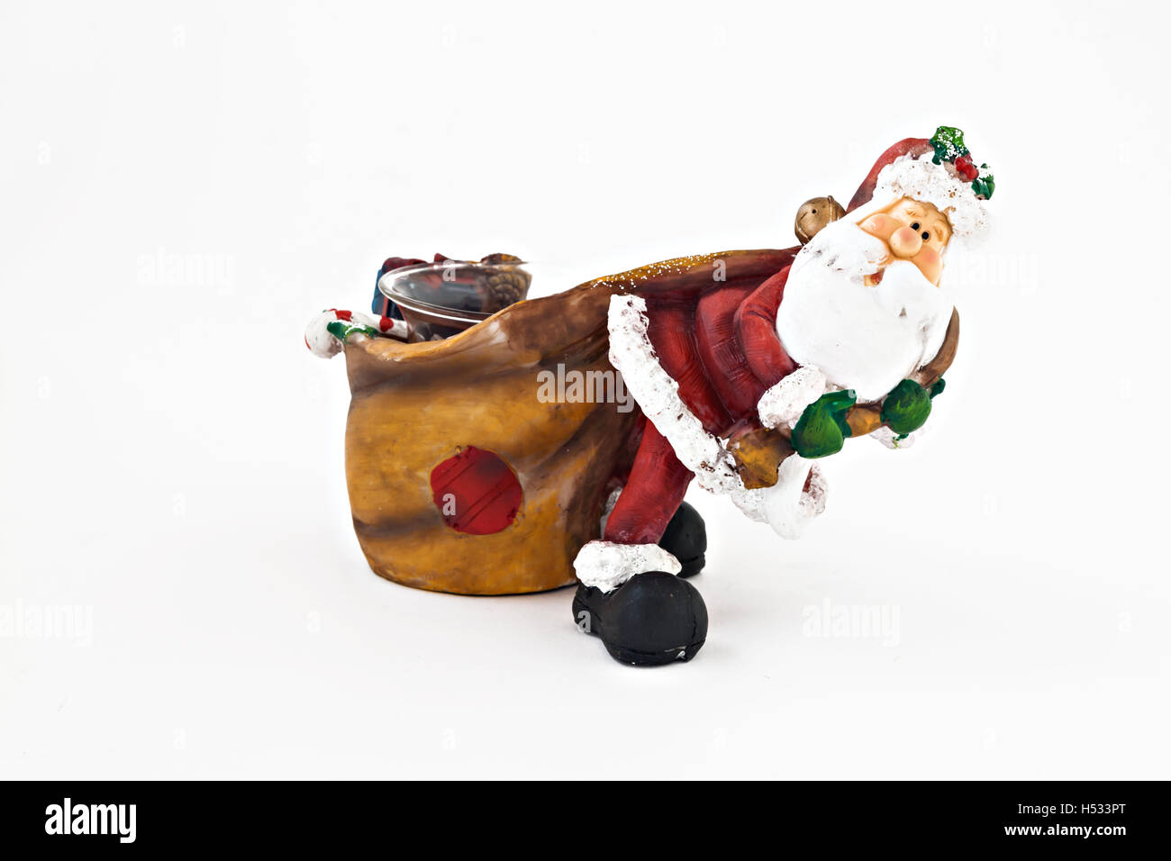 Keramik Figur des Weihnachtsmannes einen großen Sack isoliert. Stockfoto