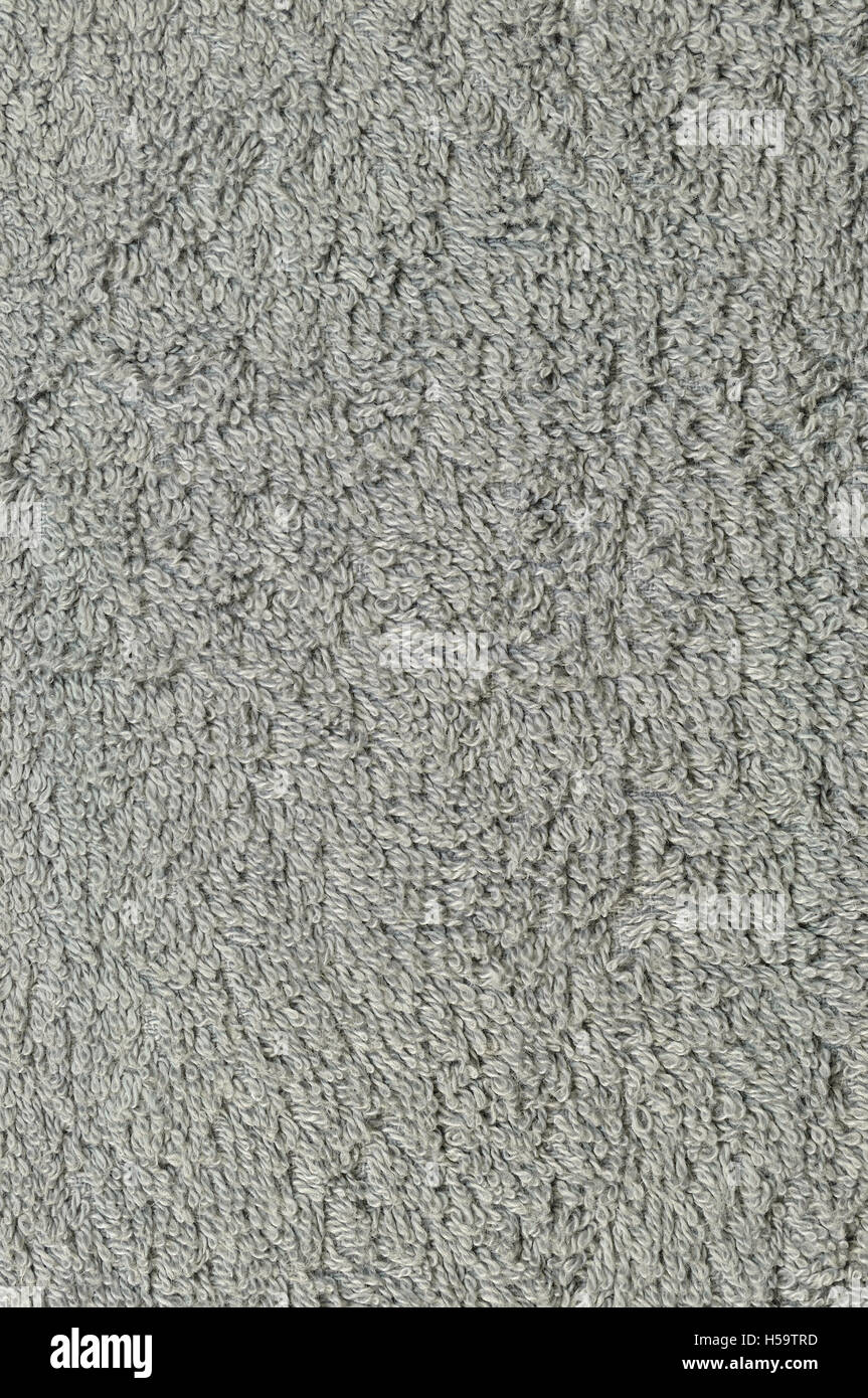 Graue natürliche Plüsch Frottee Dampfbad Strandtuch, strukturierten Stoff Makro Hintergrundmuster Closeup vertikale graue Struktur Stockfoto