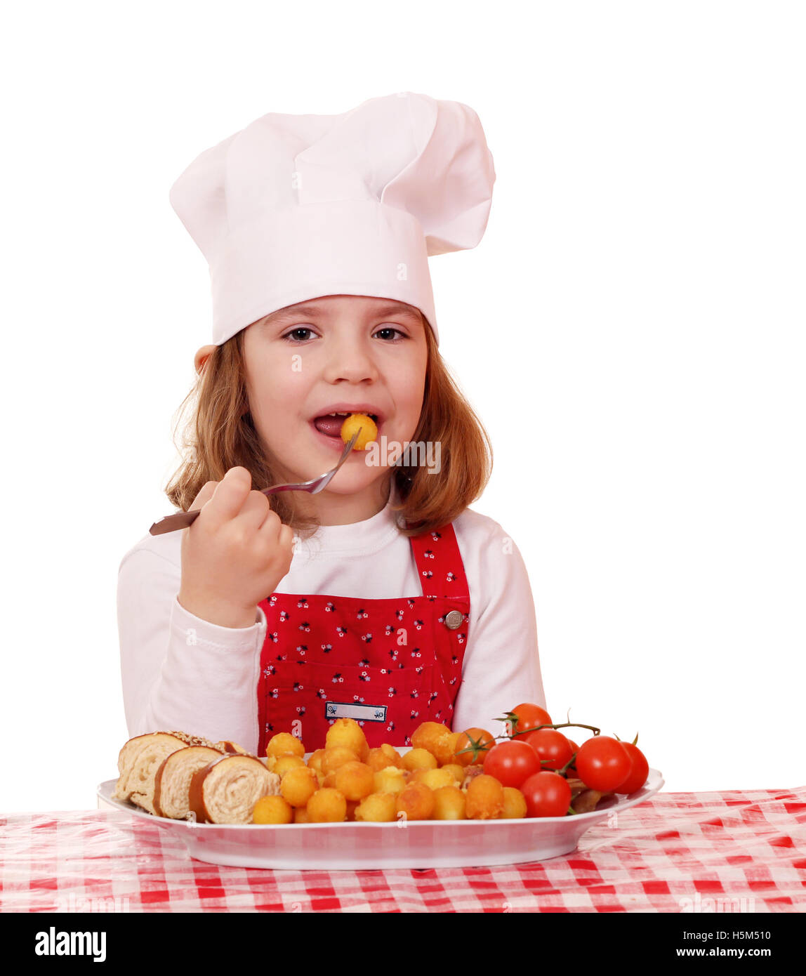 hungrige kleine Mädchen Koch Gourmet-Essen Stockfoto