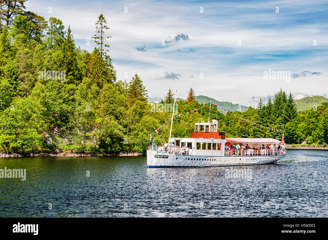 Sir Walter Scott Dampfschiff bringt seine Passagiere zurück nach einer Tour von Loch Katrine andocken Stockfoto