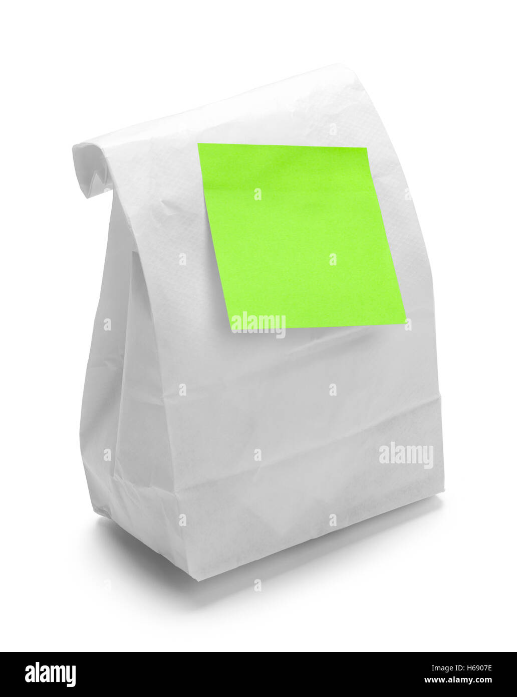 Lunchpaket mit grünen Notiz, Isolated on White Background. Stockfoto