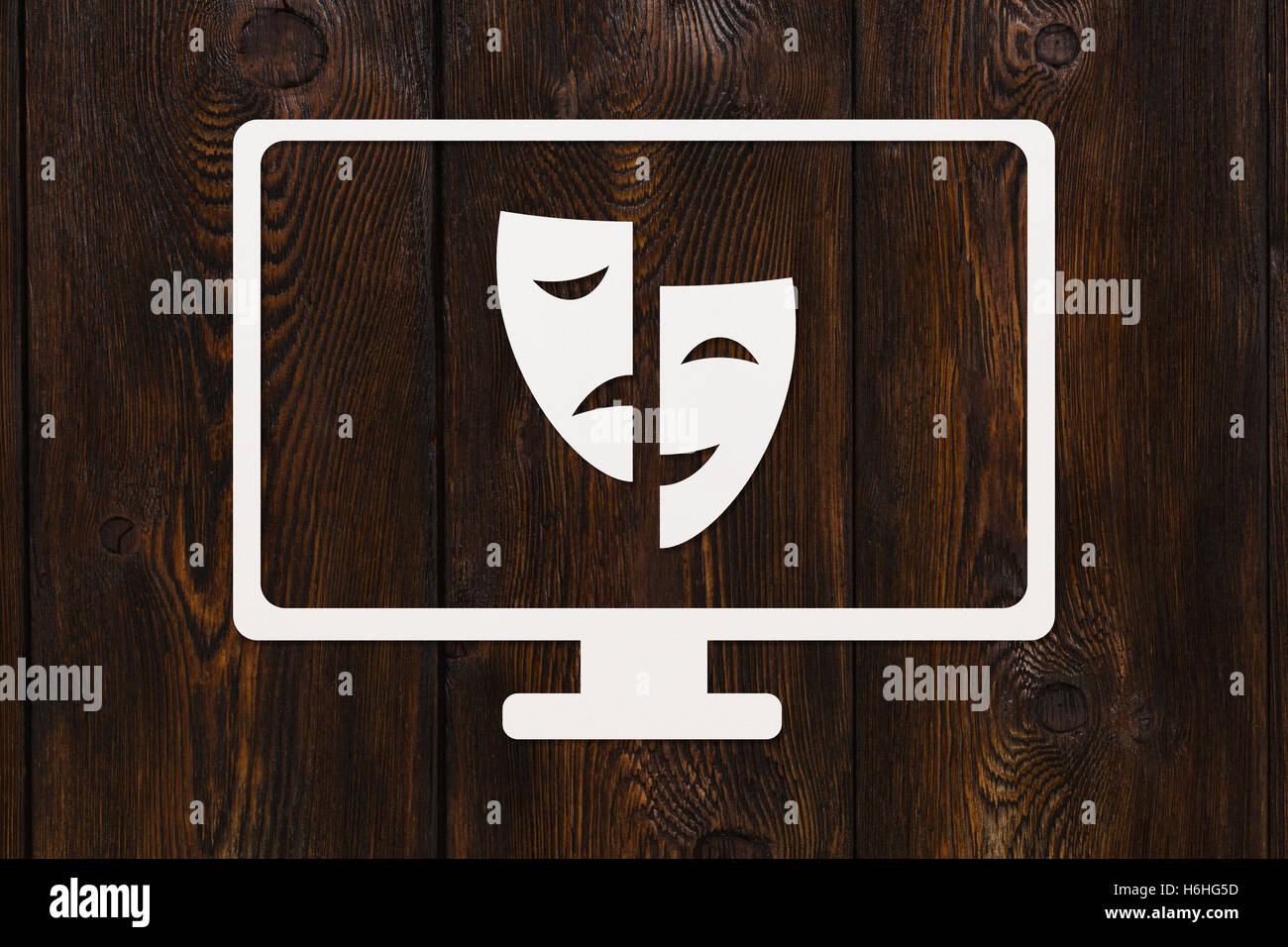 Papier-tv mit Masken. Theater Vs Film. Abstrakte Konzeptbild Stockfoto