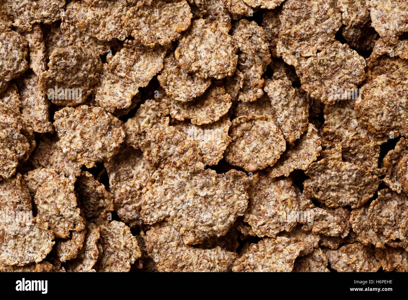 Nahaufnahme Detail Weizenkleie Frühstück Getreideflocken als flachen Hintergrund. Keine Milch. Stockfoto