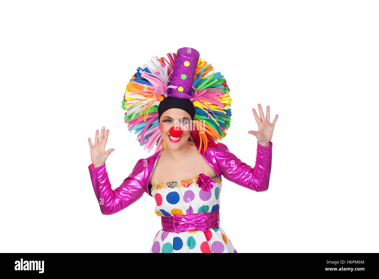 Lustiges Mädchen Clown mit einem großen bunten Perücke isolierten auf weißen Hintergrund Stockfoto