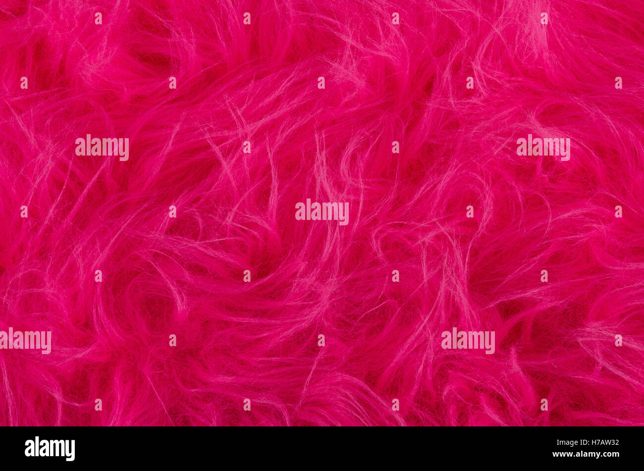 Rosa Plüsch. Sehr weicher Polyester-Textilien hergestellt aus synthetischen Fasern mit langen Haaren. Makro schließen Material Fotografie. Stockfoto