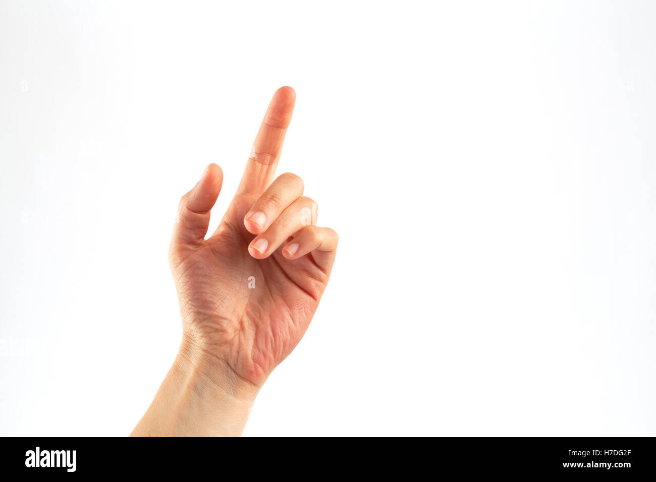 Weibliche Hand Klopfen mit einem Finger isoliert auf weiss Stockfoto