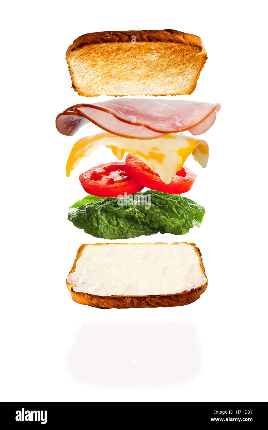 Alle Zutaten für einen geschmolzenen Käse und Schinkensandwich fallen an ihren Platz Stockfoto