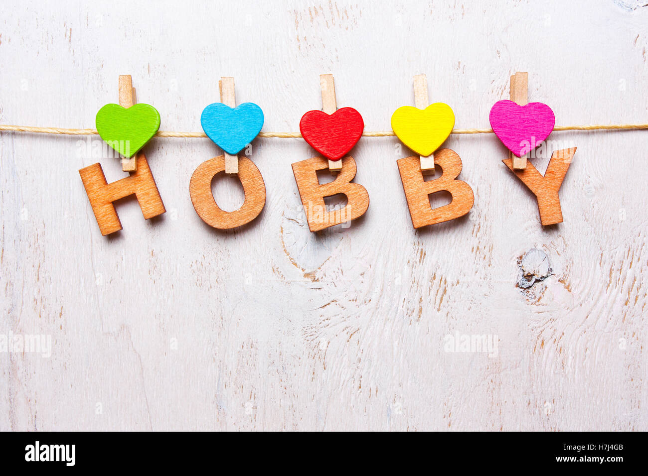 das Wort "Hobby" der hölzernen Buchstaben auf weißem Hintergrund Stockfoto
